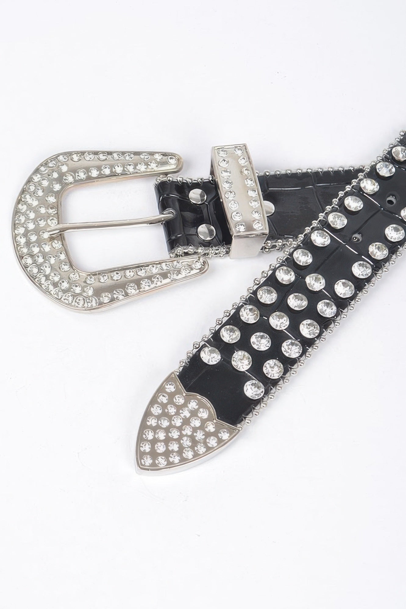 Black studded belt close-up with rhinestone oval buckle plate