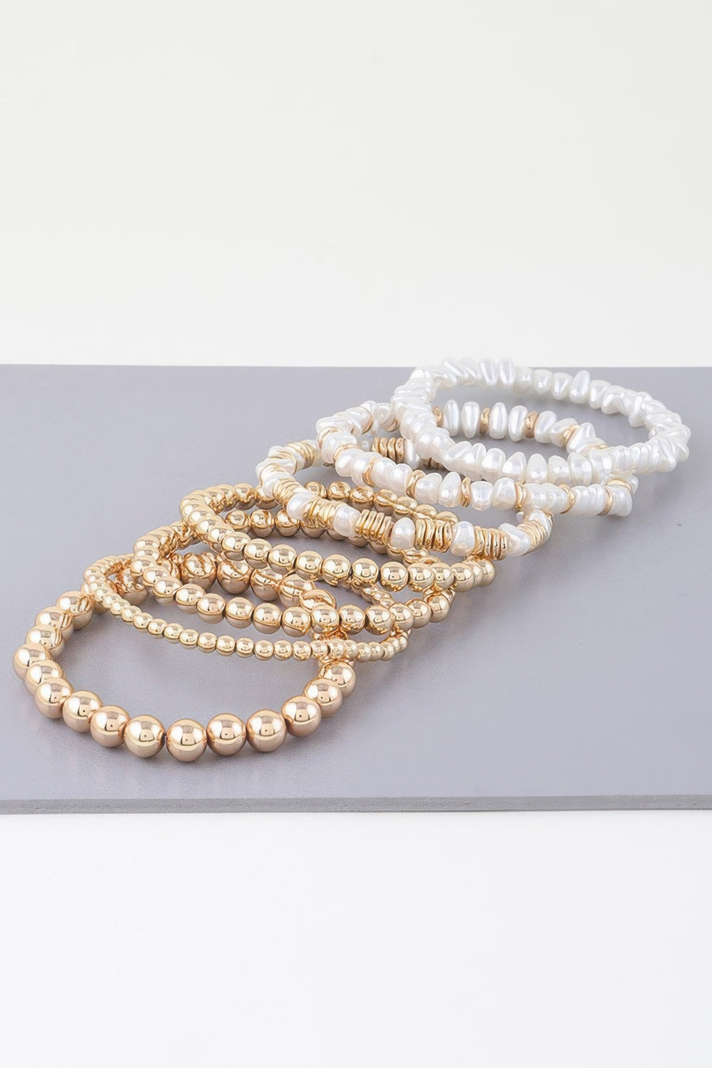 Multi-strand pearl beaded bracelet, white pearls with gold-tone bead accents