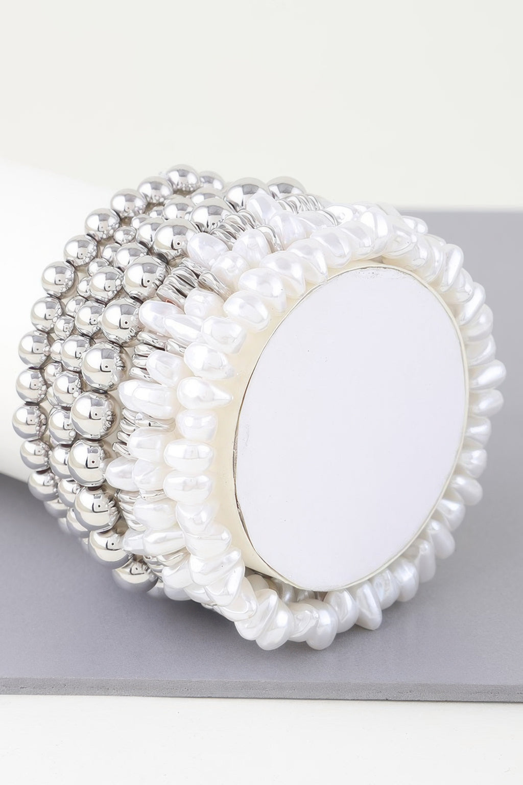 Multi pearl beaded bracelet in silver-tone and white pearls with oval center plate