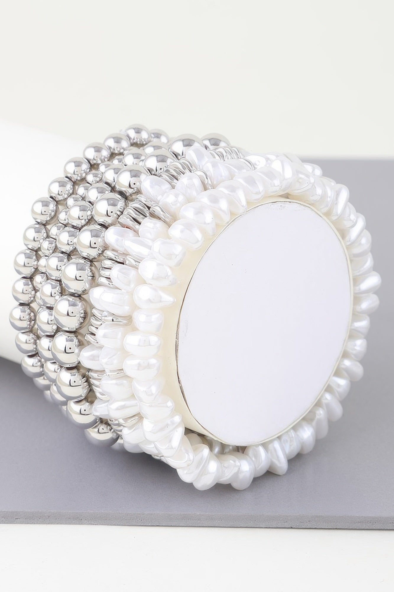 Multi pearl beaded bracelet in silver-tone and white pearls with oval center plate