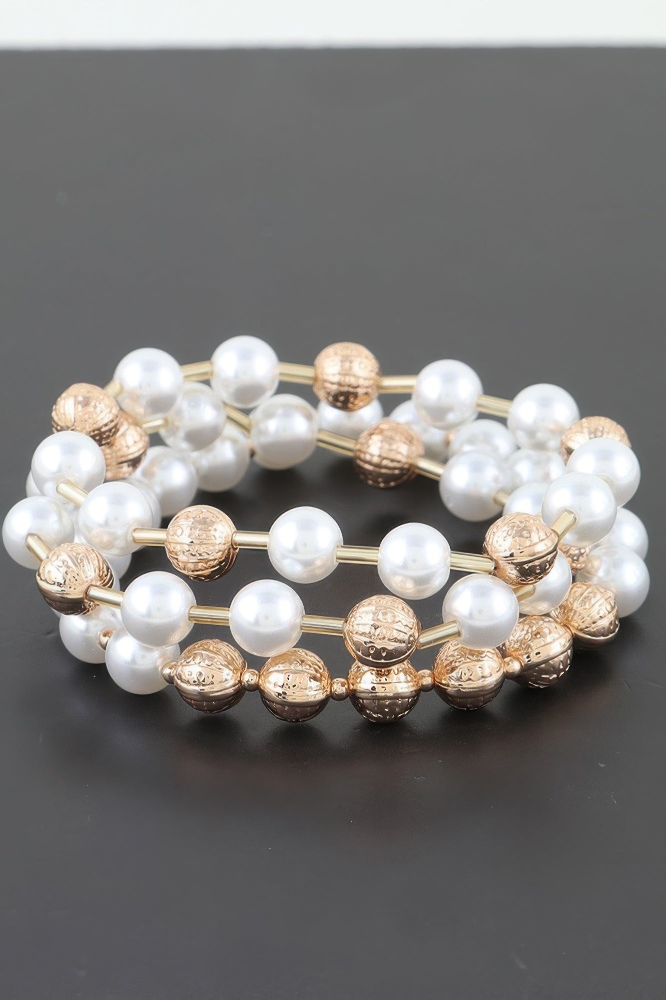 Gold cream and white pearl bead bracelet, linked round textured accents