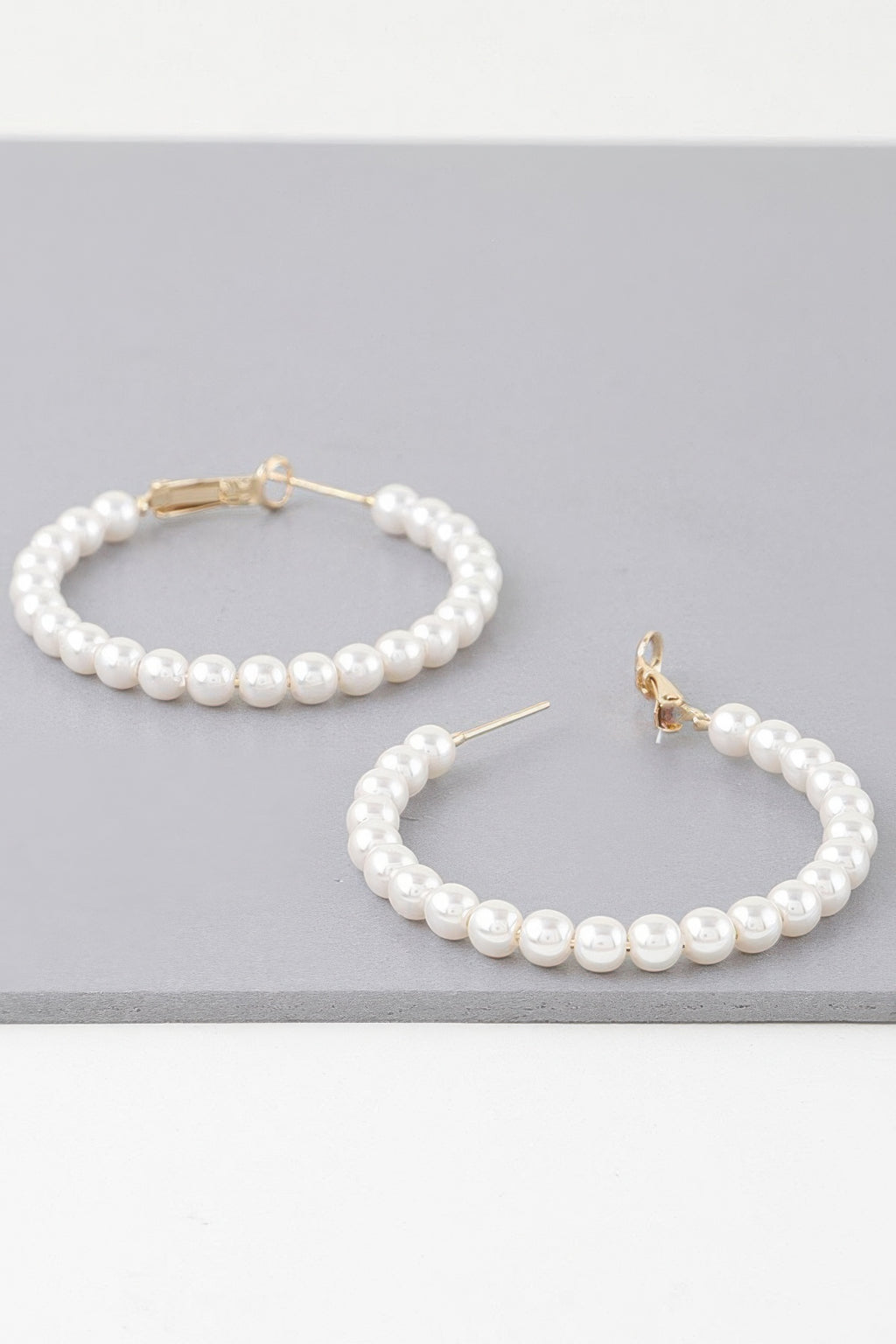 Multi pearl hoop earrings with gold-tone hoops and cream round pearls