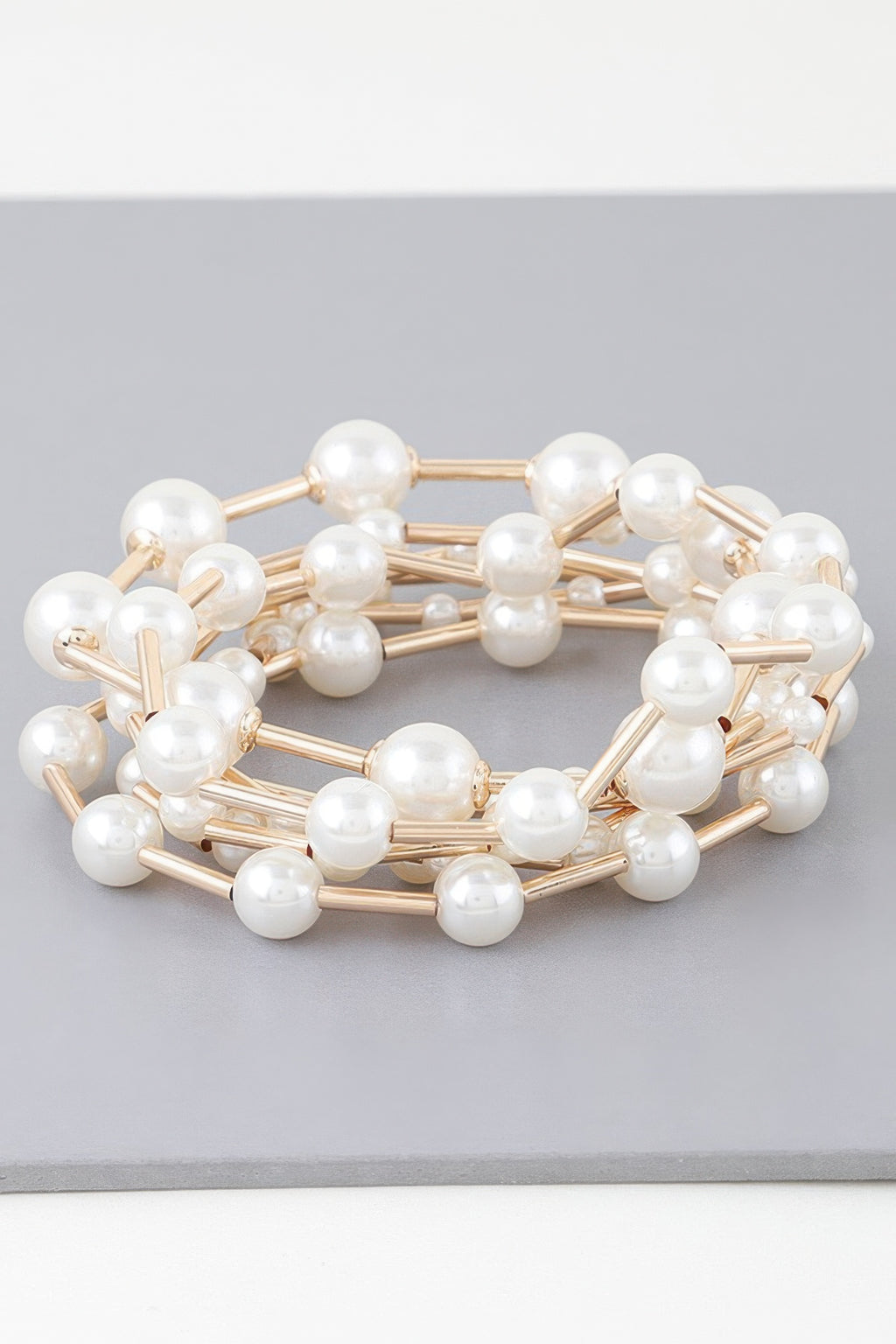 Multi pearl wire bracelet, round white pearls on gold-tone wire links