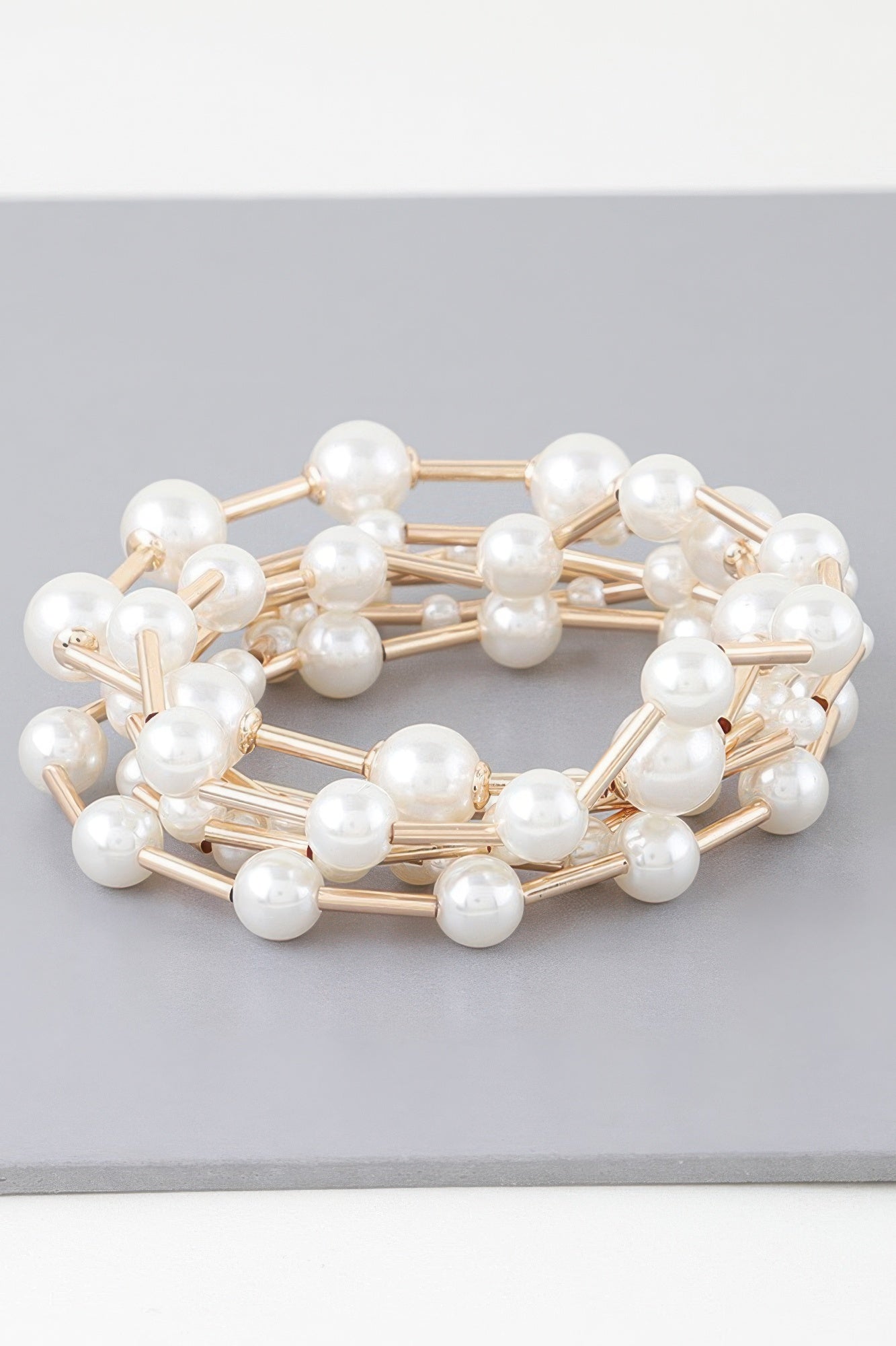 Multi pearl wire bracelet, round white pearls on gold-tone wire links