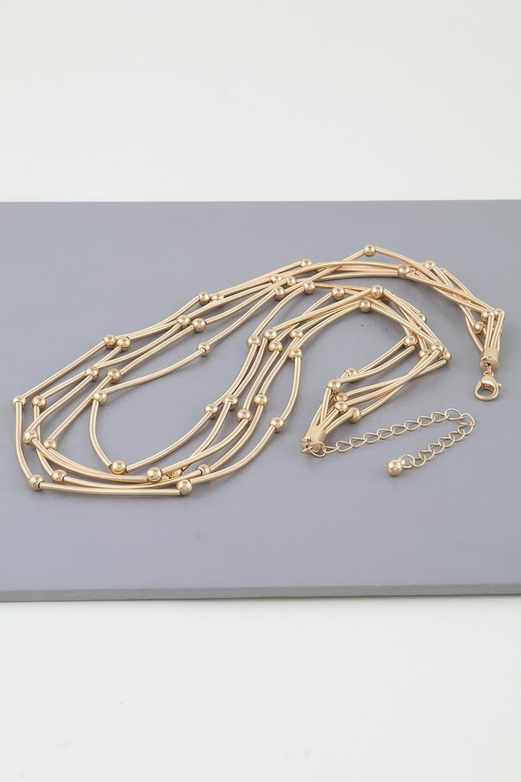 Multi pillar beaded necklace, gold-tone multi-strand design with round bead accents