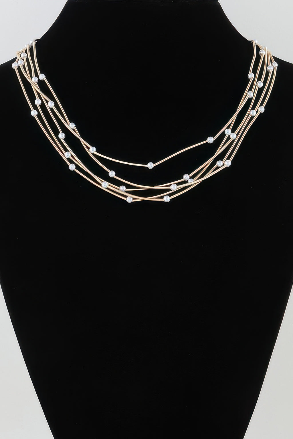 Multi pillar beaded necklace, gold-tone multi-strand design with round bead accents