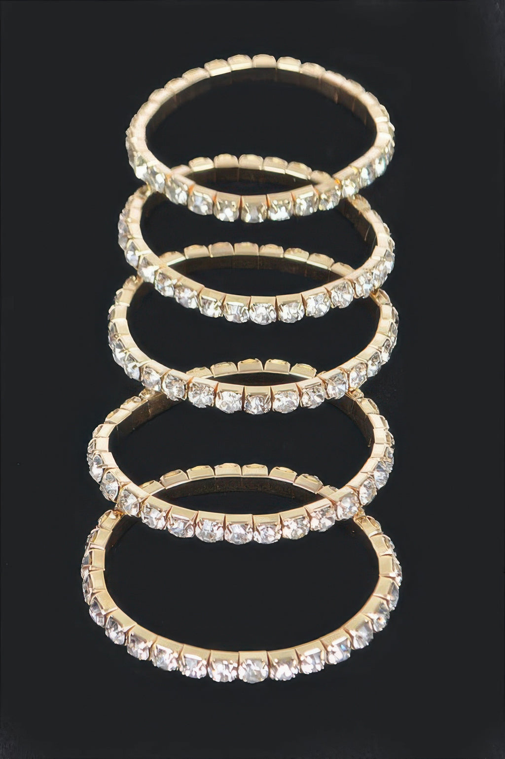 Gold multi rhinestone stretch bracelet with stacked rows of clear square crystals