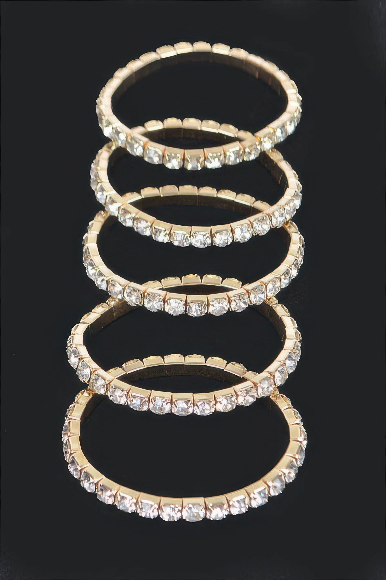 Gold multi rhinestone stretch bracelet with stacked rows of clear square crystals