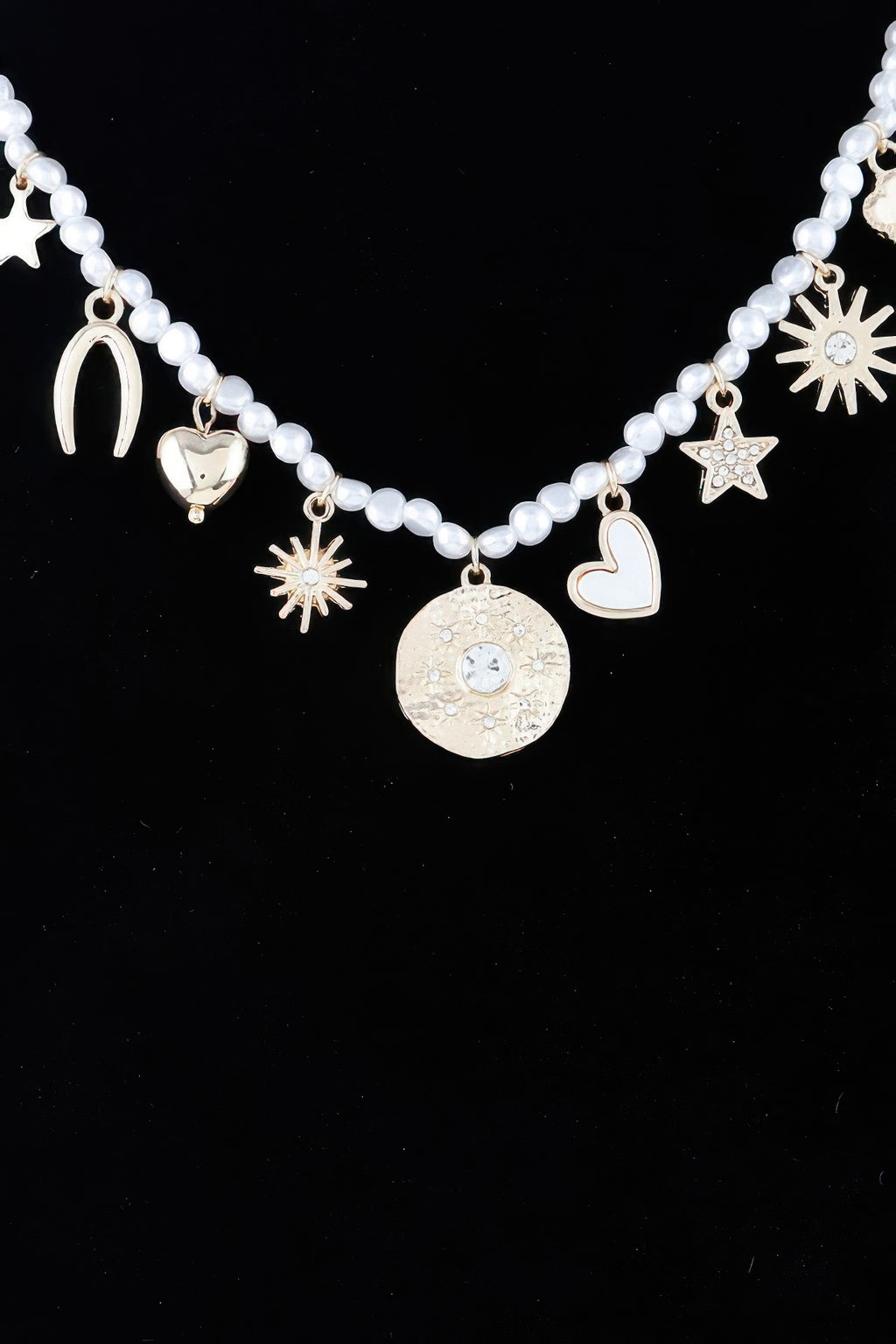 Multi-charm beaded necklace with circular pendant, stars, hearts and sunburst charms