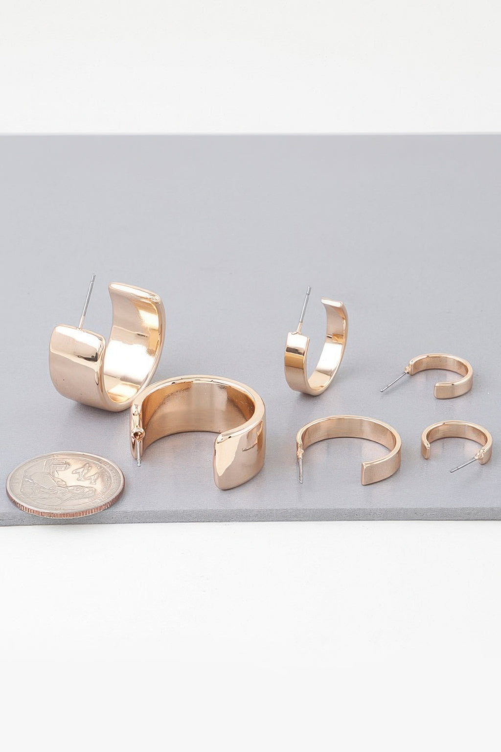 Gold modern hoop earrings set with open C-shape hoops and straight posts