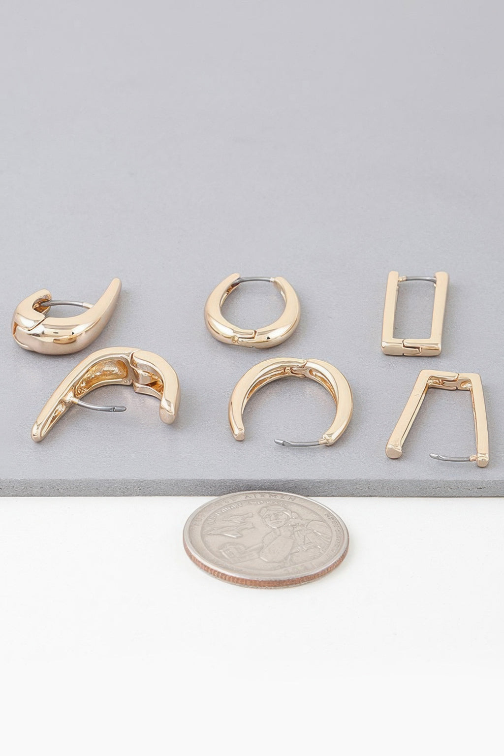 Gold hoop earring set with mixed modern hoop shapes and clasp backs