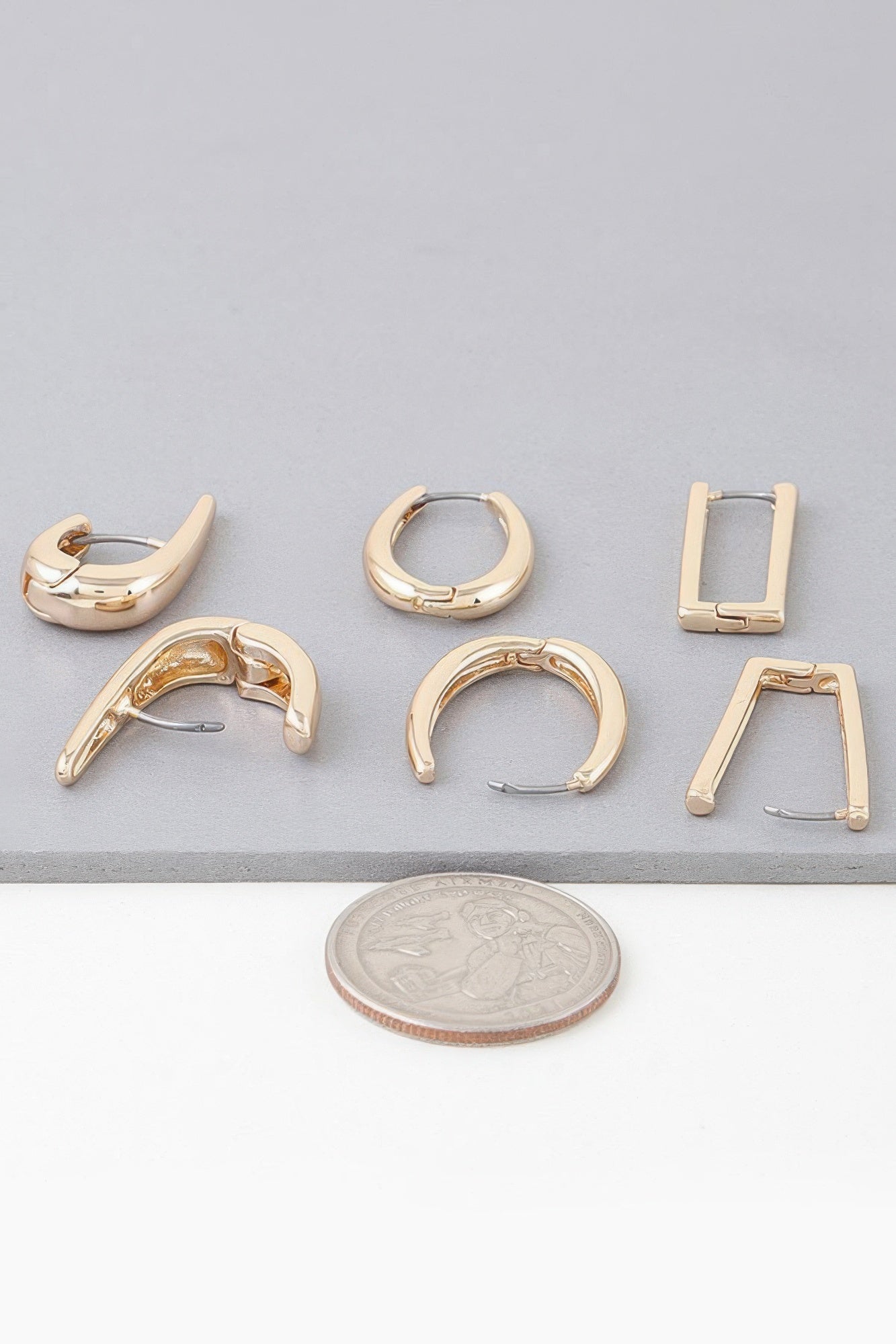 Gold hoop earring set with mixed modern hoop shapes and clasp backs