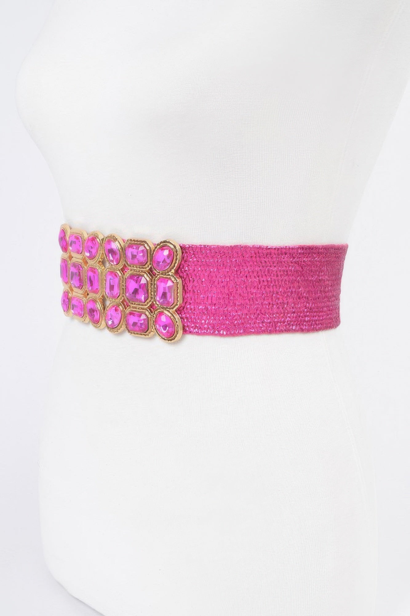 Fuchsia metallic stretch belt with rhinestone cluster shown from the side