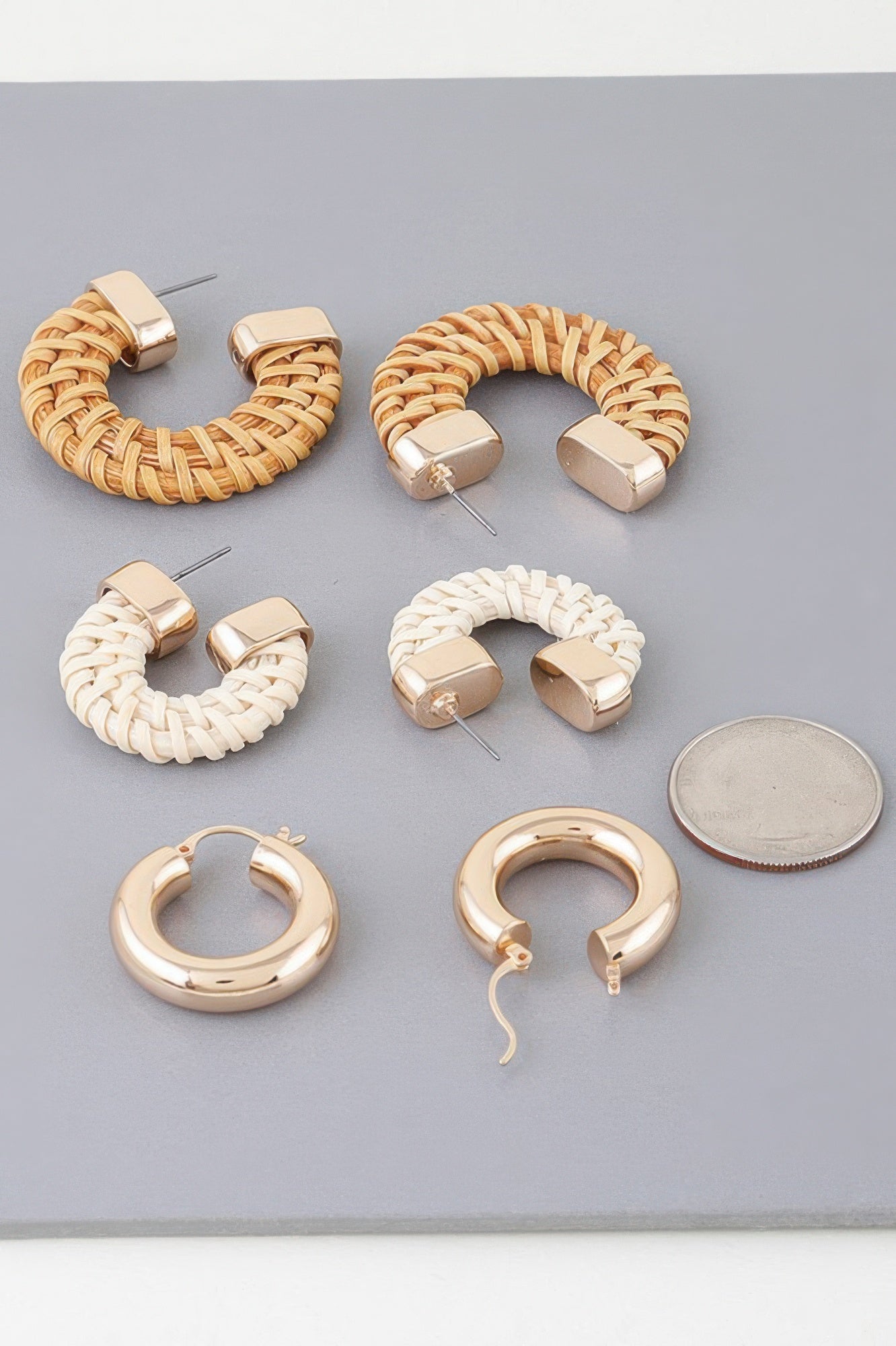 Triple woven hoop earring set with tan and white braids, gold-tone posts and hoops