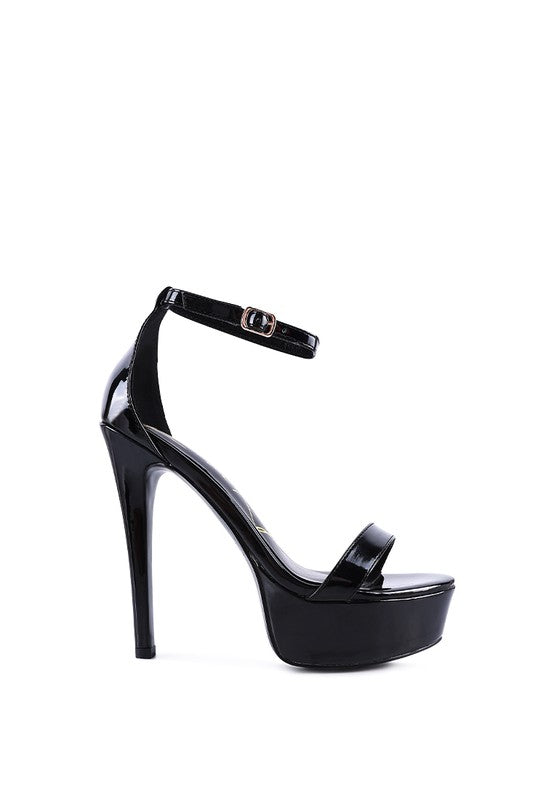 Black high-platform stiletto sandal with thin ankle strap and glossy open toe