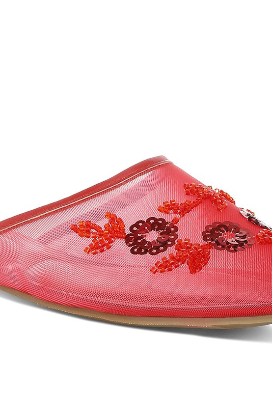 Close-up of red mesh mule toe with floral bead and sequin embroidery.