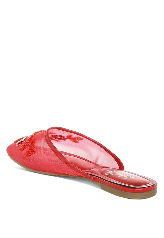 Red mesh mule from side, slip-on design with decorative beaded flowers.