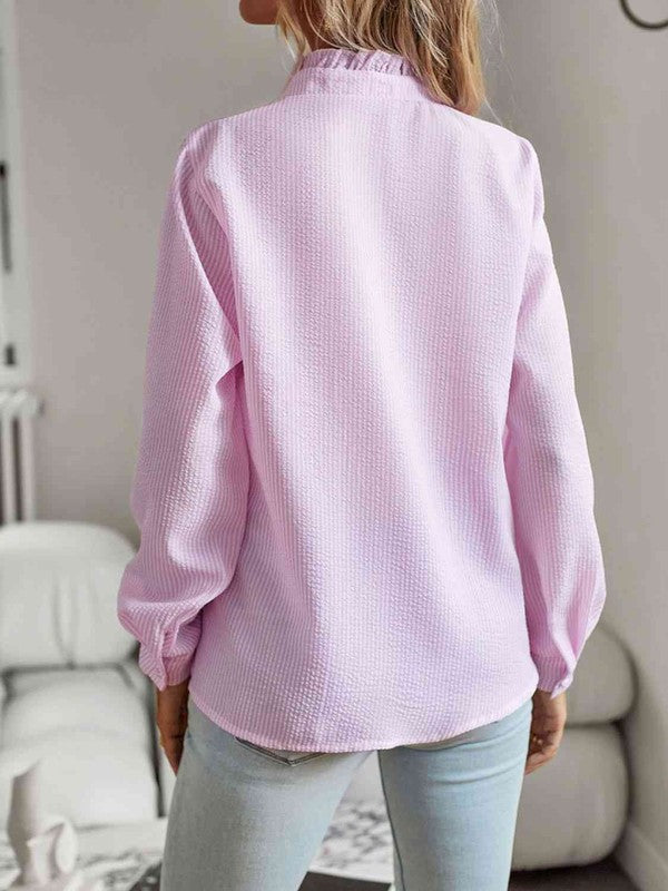 Nat ruffle trim shirt, back view with long sleeves and buttoned front