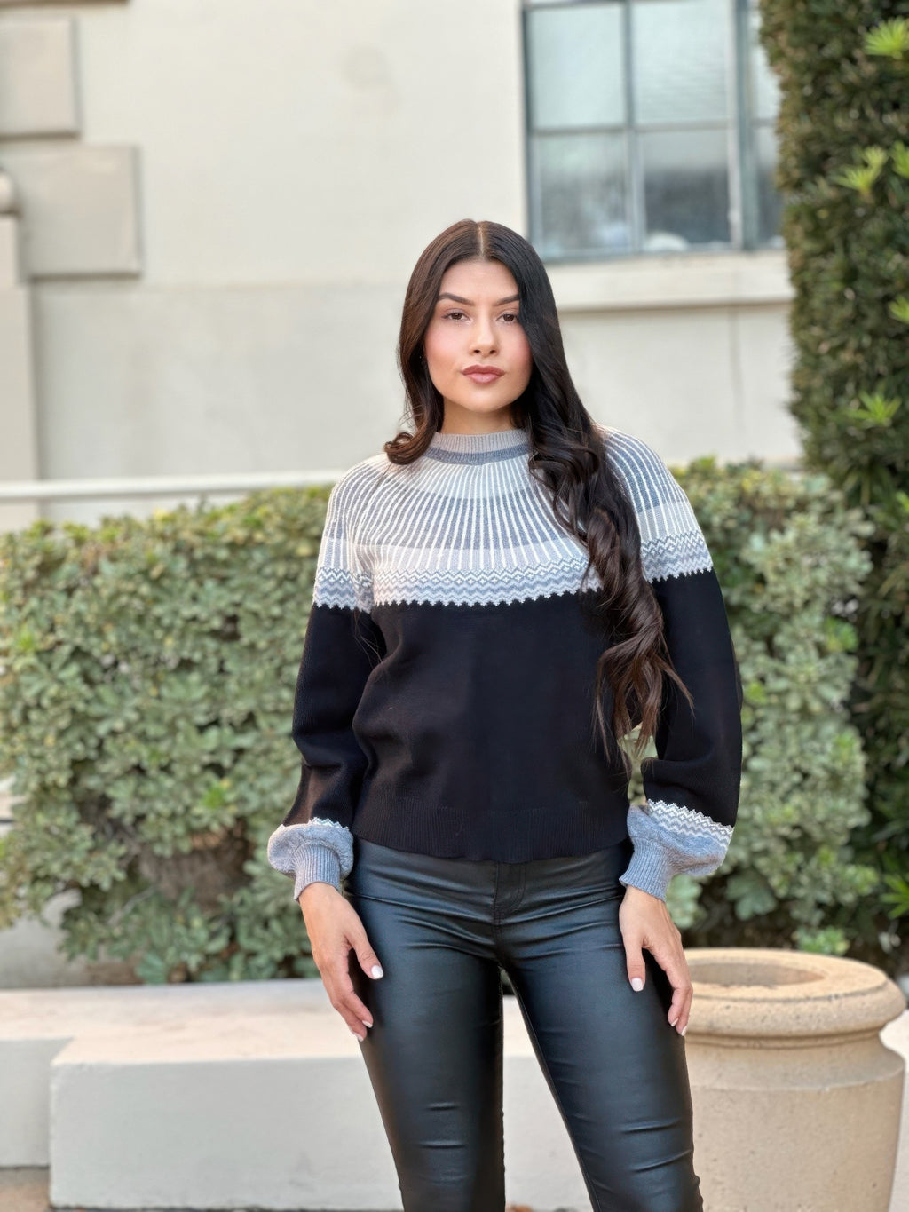 Color block knit sweater with light blue crew neck and cuffs, dark knit body