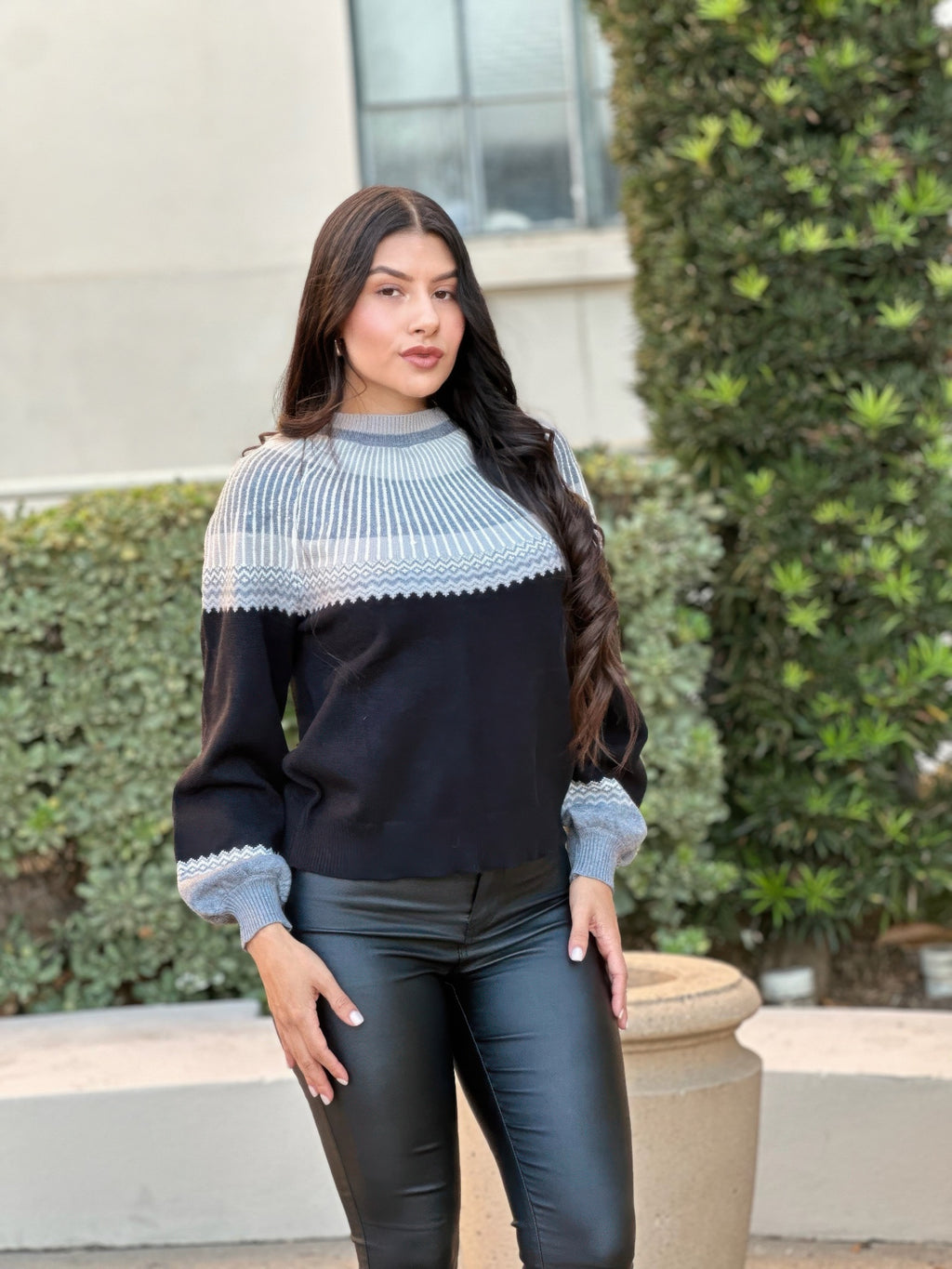 Light blue patterned yoke knit sweater with dark raglan sleeves