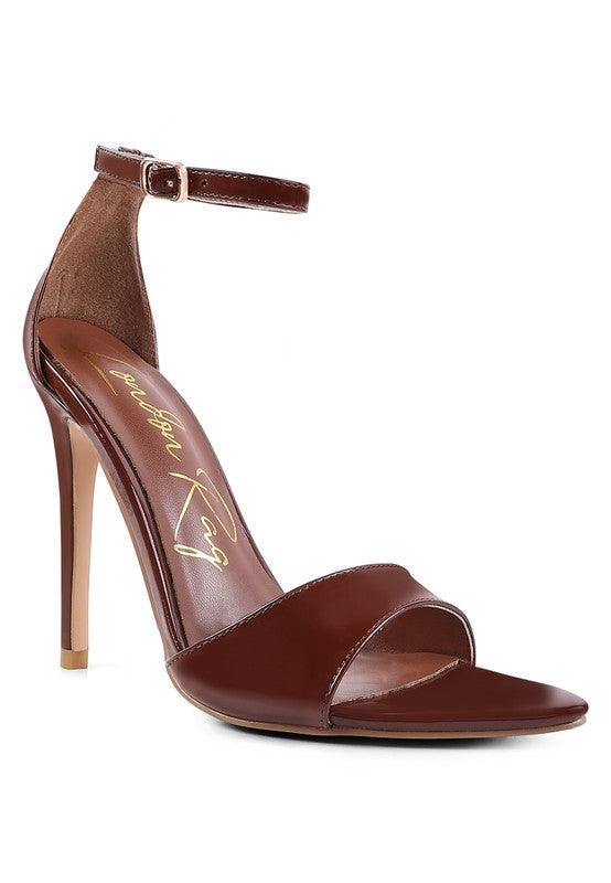 Dark-brown ankle-strap high-heel sandal with open toe and smooth finish.