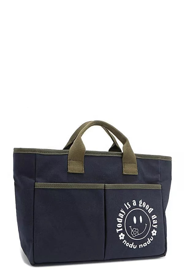 Navy canvas tote with olive top handles and front logo patch