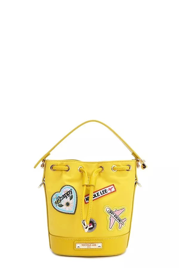 Yellow bucket bag with decorative front patches and top grommet eyelet drawstring