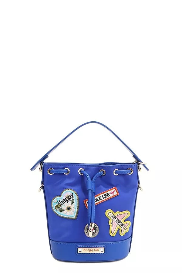 Blue bucket bag side view with patch appliqués and drawstring top