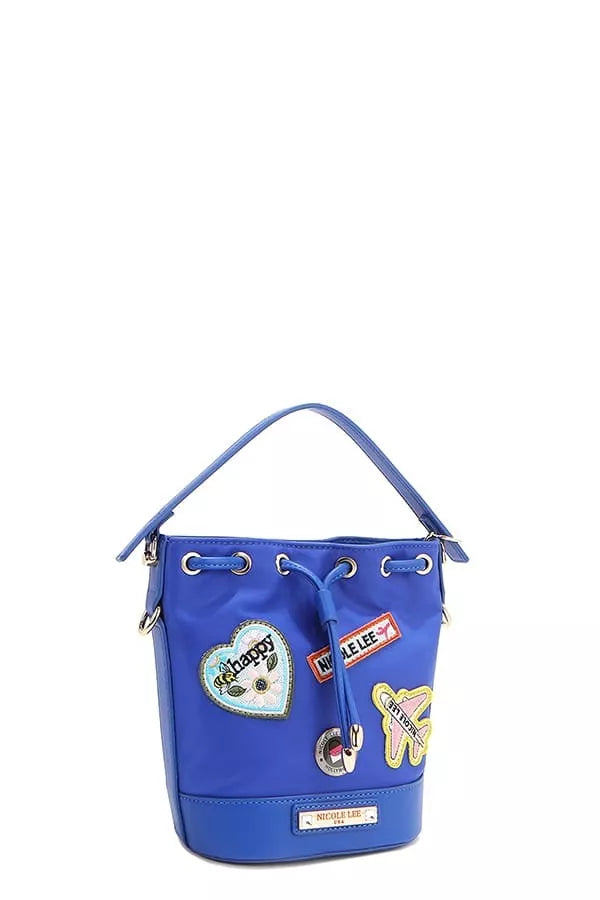 Blue bucket bag angled view showing patches and grommet handle row