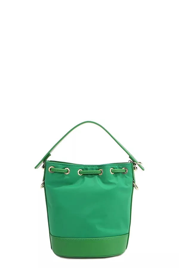 Green bucket bag back view with top handle and three ring strap detail.