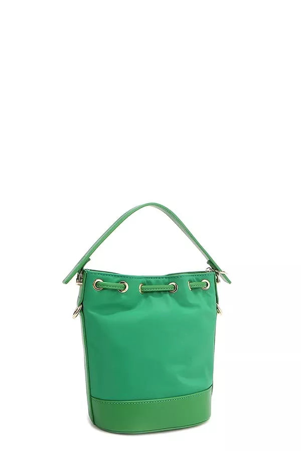 Green bucket bag side view with top handle and strap rings at the top.