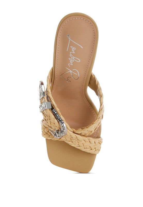 Beige interior view showing thong strap with braided detail and silver-toned buckle