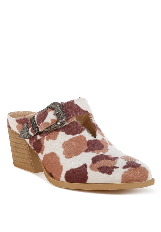 Faux suede buckle mules with cow print upper and block heel, side view