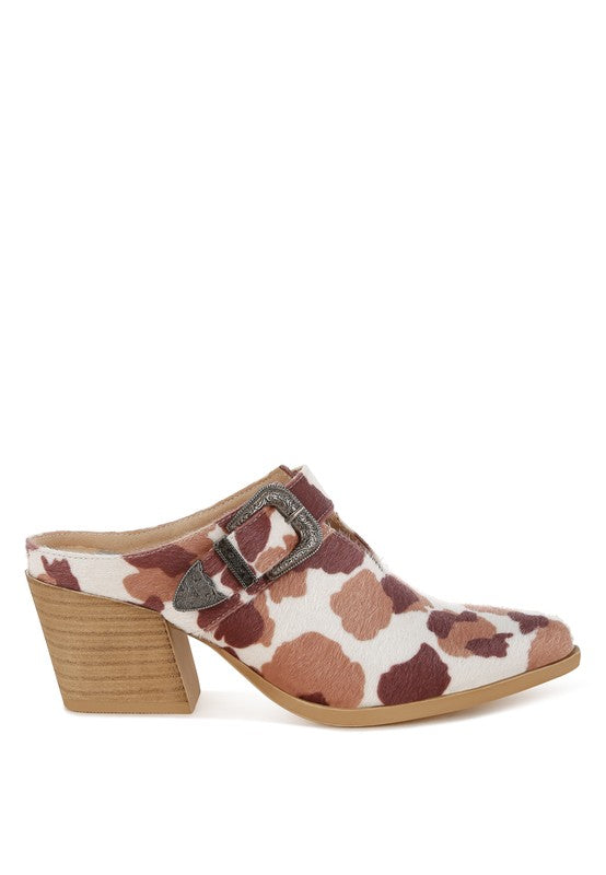 Cow print faux suede mules with square buckle and mid block heel, front 3/4 view