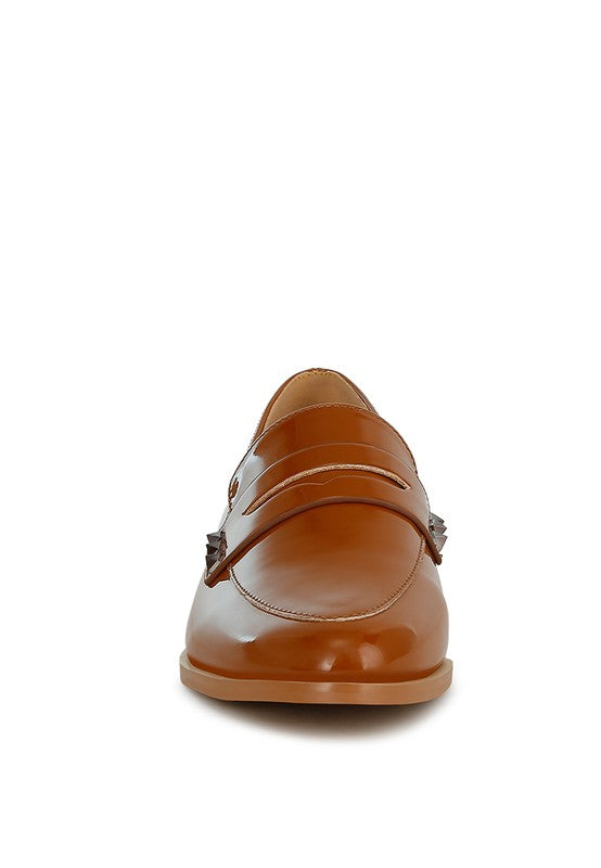 Back view patent pleather penny loafers in tan brown with stitched heel and strap