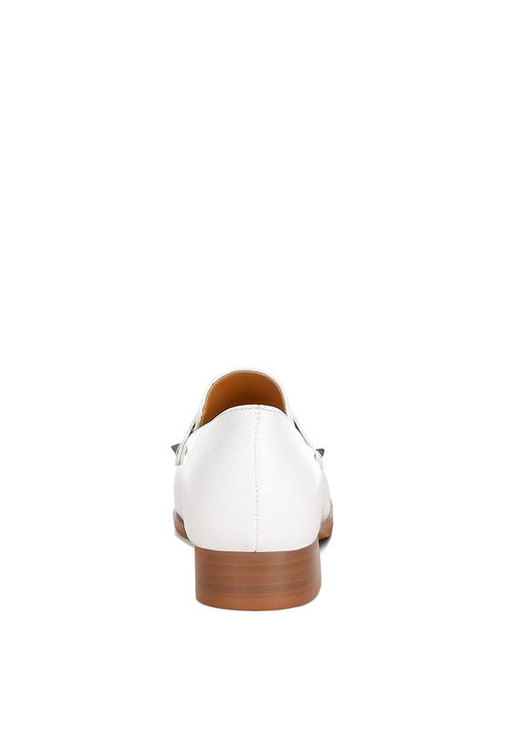 Off-white patent pleather penny loafers, back view showing stacked wooden-look heel