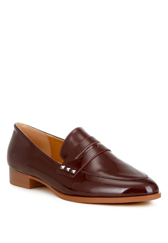 Patent pleather penny loafers in deep brown with metal-stud strap and low block heel