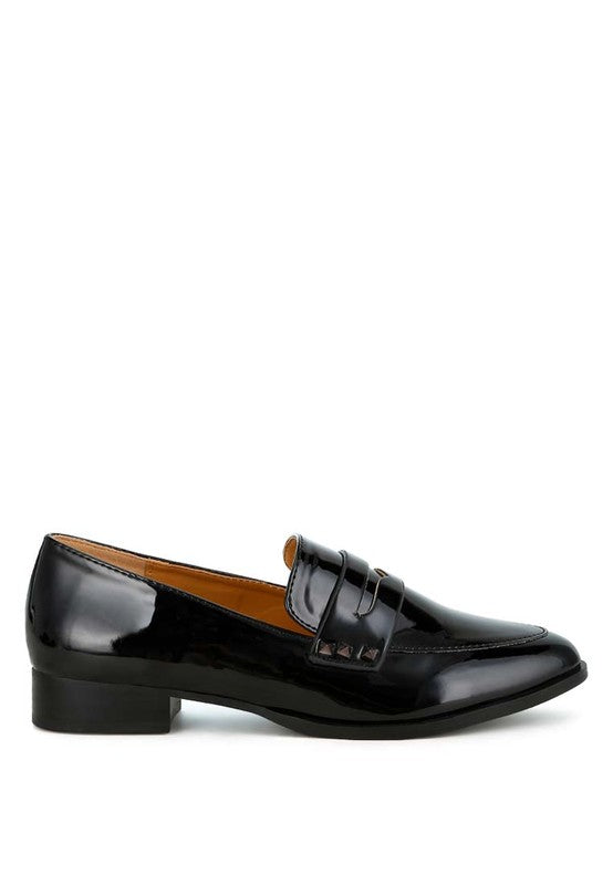 Black patent pleather penny loafers, side profile with strap and stitching