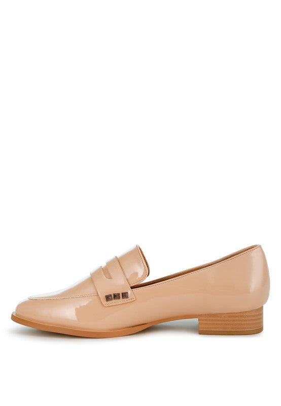 Off-white patent pleather penny loafers with curb strap and wood-look heel