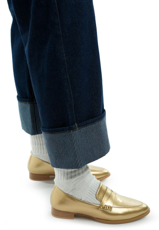 Gold patent penny loafers with strap and metal bit detail