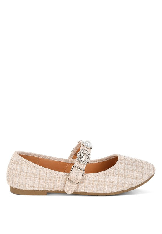 Beige Mary Janes with adjustable buckle strap and ornate jewel-pearl charm detail