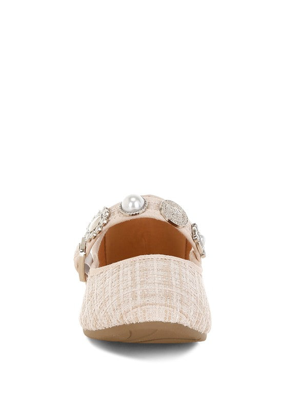 Beige tweed Mary Janes with pearl charm on the back strap and embellished side trim