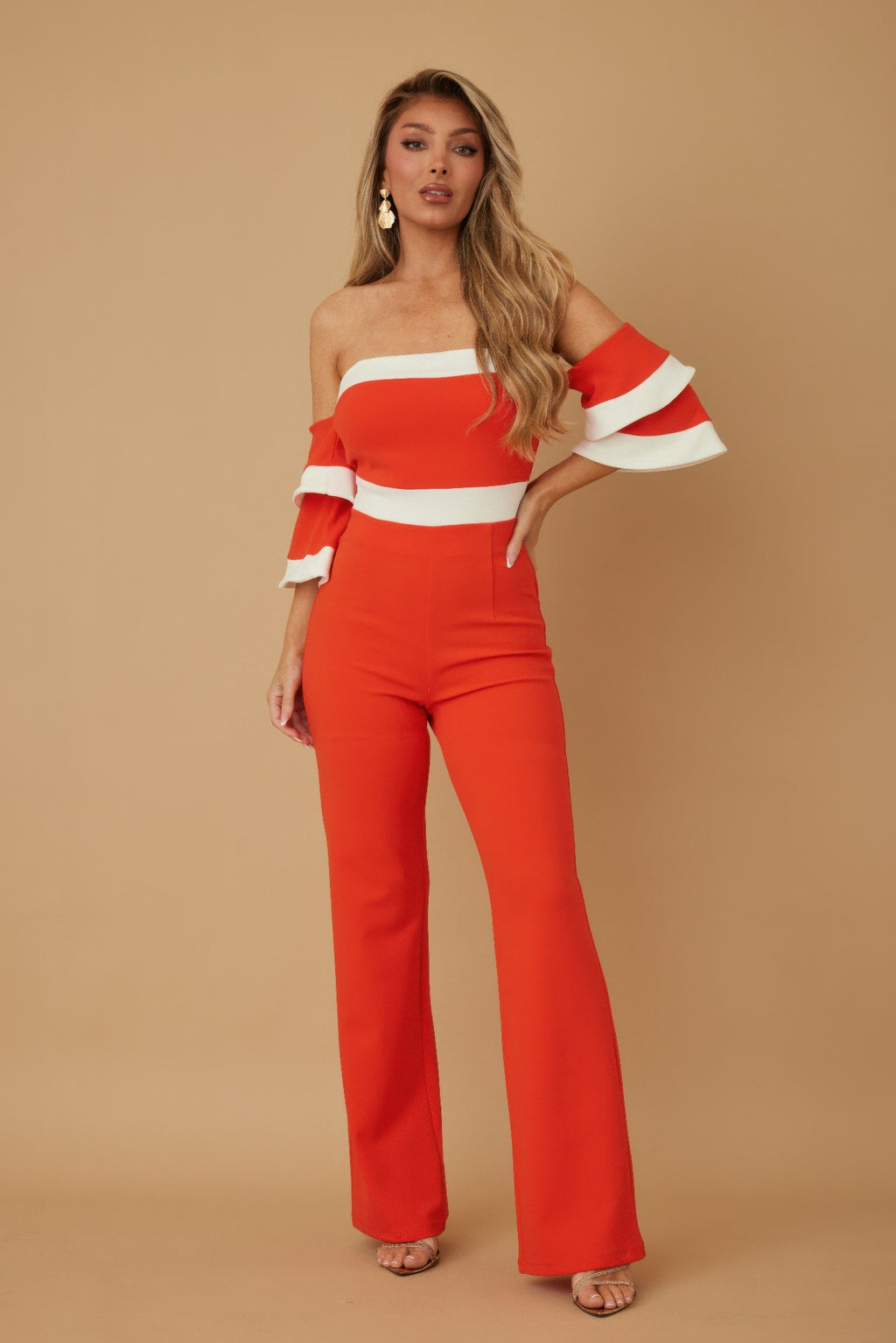 Orange off-shoulder jumpsuit with white striped bandeau top and flared wide legs