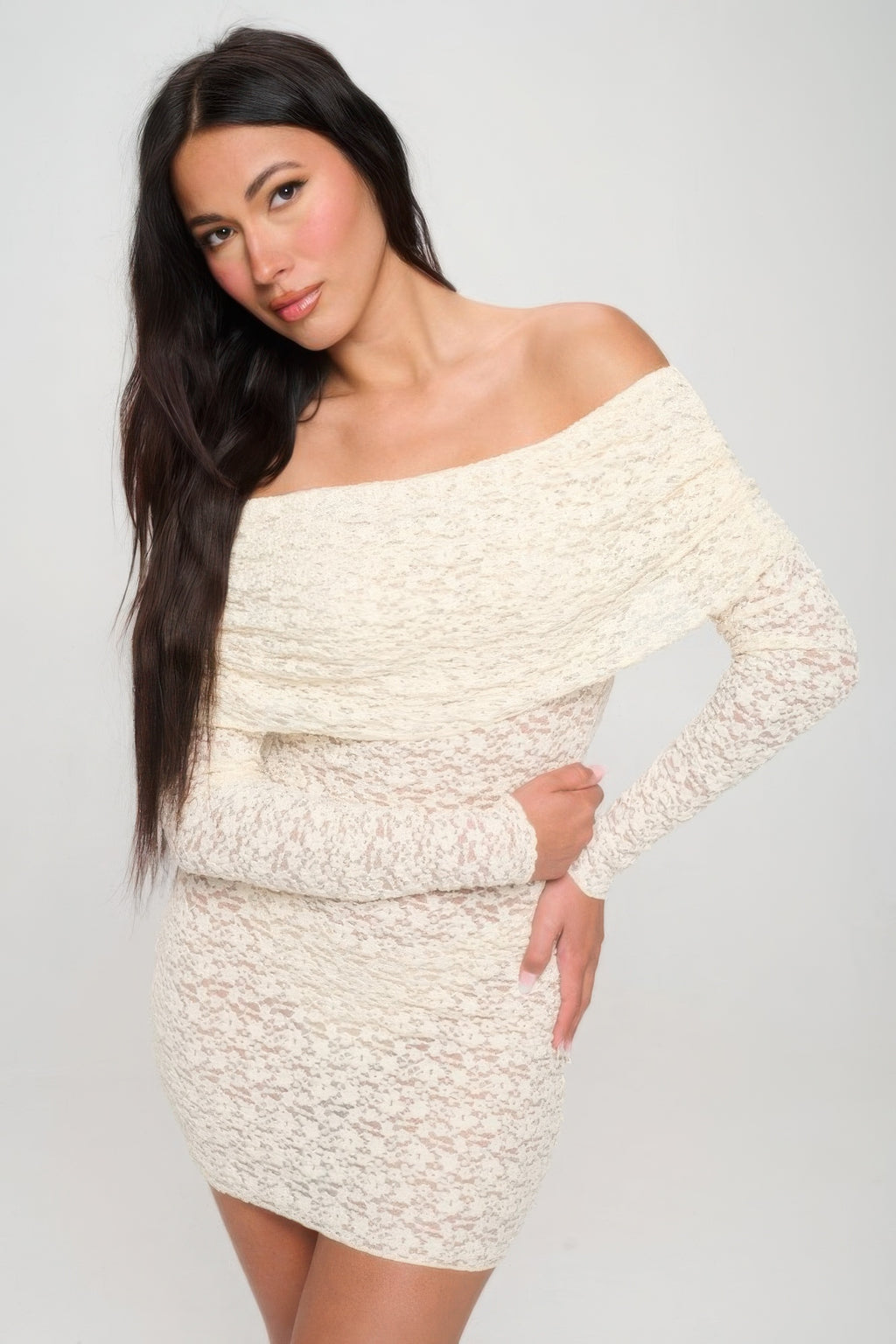 Cream off-shoulder lace mini dress close-up: long sleeves and fitted waist detail