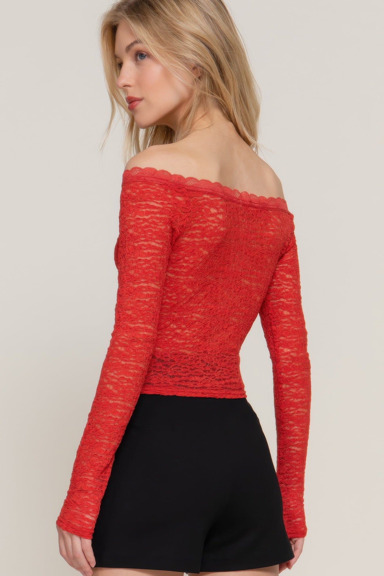Brick red off-shoulder lace top with long sleeves and scalloped neckline