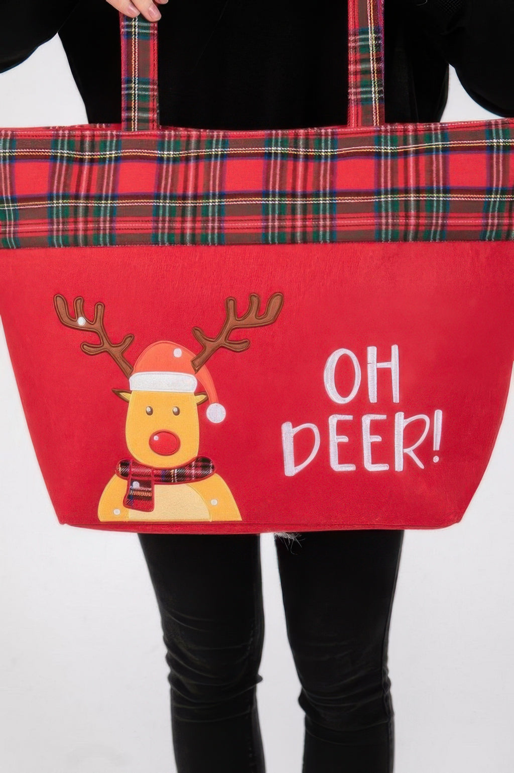 Close-up of red tote bag: plaid top band, reindeer face, and “OH DEER!” text