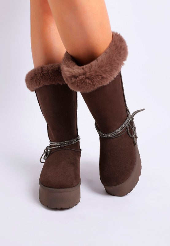 Brown ankle snow boots with faux fur trim and lace tie detail