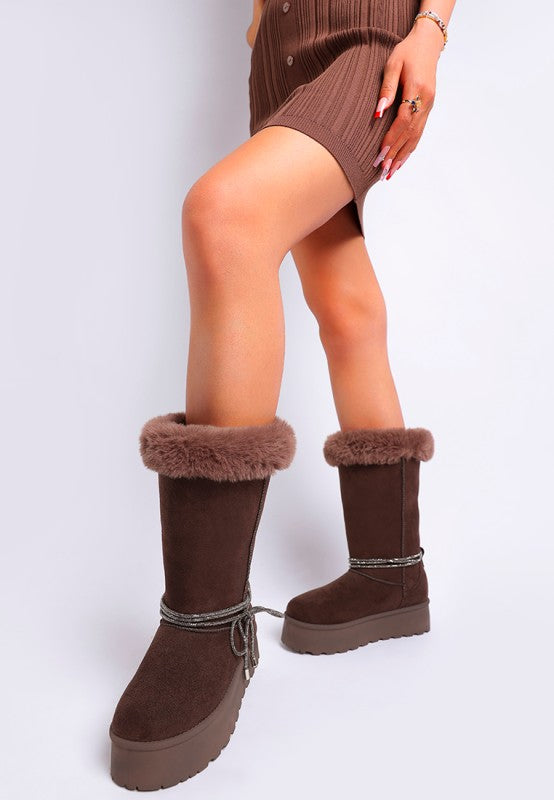 Brown winter calf boots with faux fur cuff and lace tie at the ankle