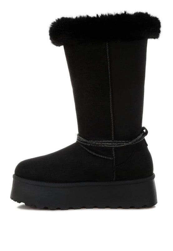 Black knee-high snow boots with faux fur cuff and thick outsole