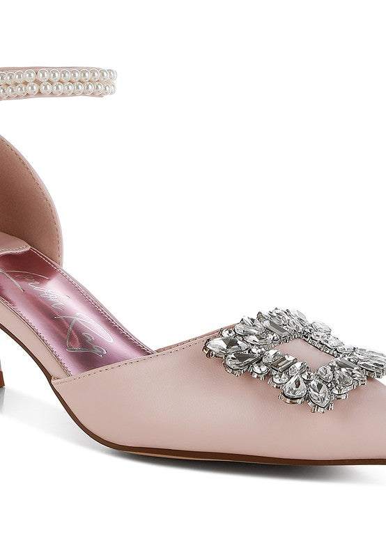 Pink kitten-heel sandal with rhinestone bow brooch detail and crystal-studded strap